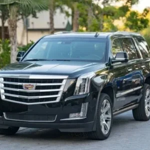 Black Cadillac Escalade SUV parked on street
