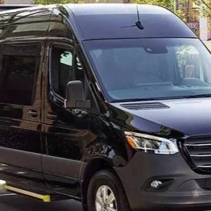 Black Mercedes-Benz Sprinter passenger van parked